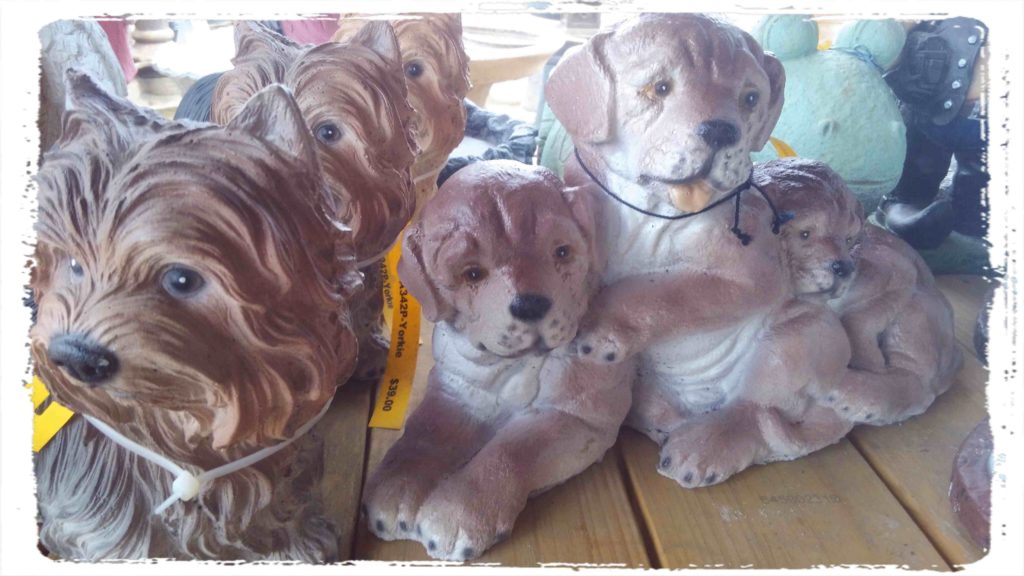 Painted puppy statue! How much are those doggies in the window?