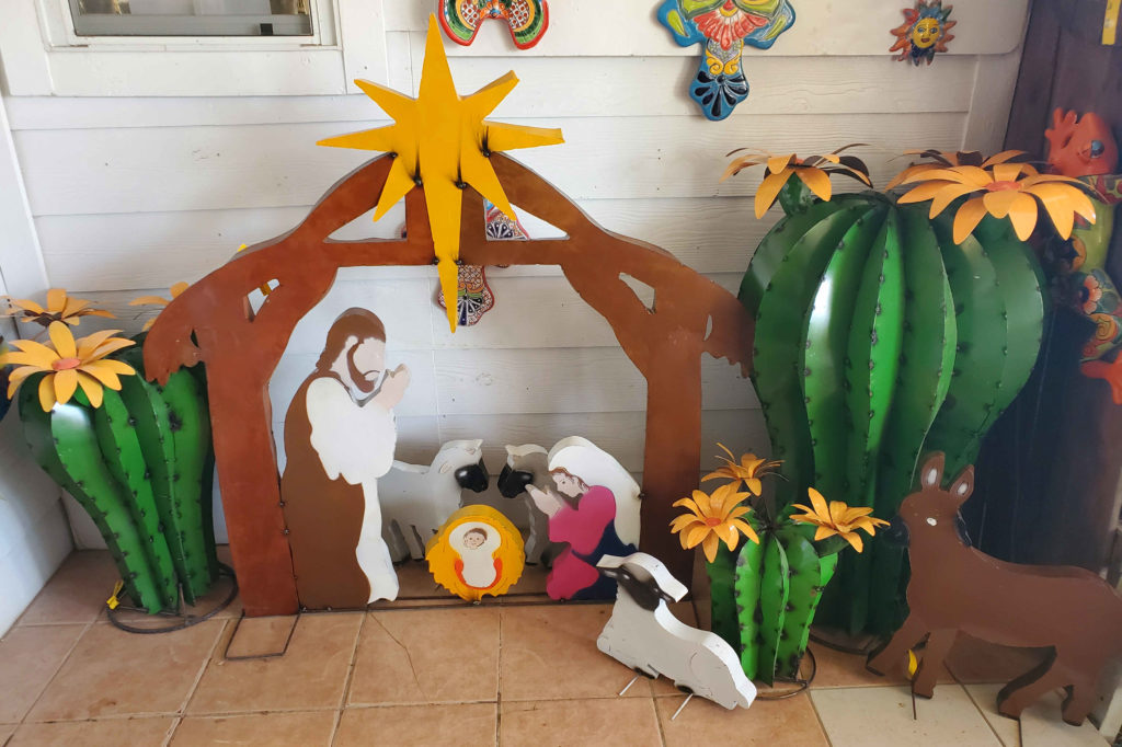 Metal Nativity Scene with Sheep and Donkey. Cactus plant with blooms!